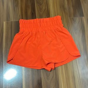 New in orange shorts